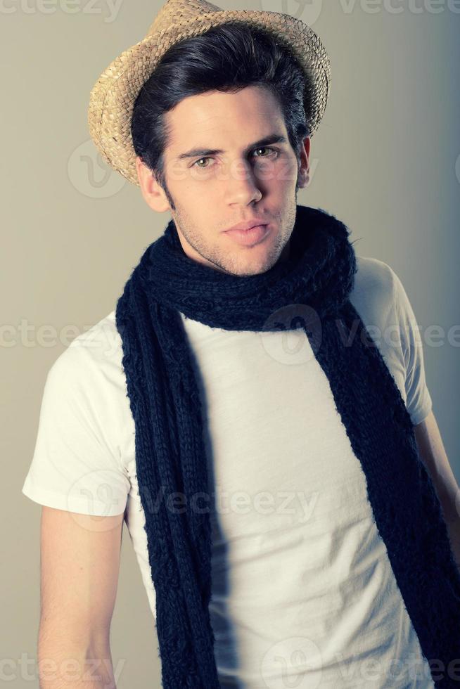 Handsome man wearing hat and scarf photo