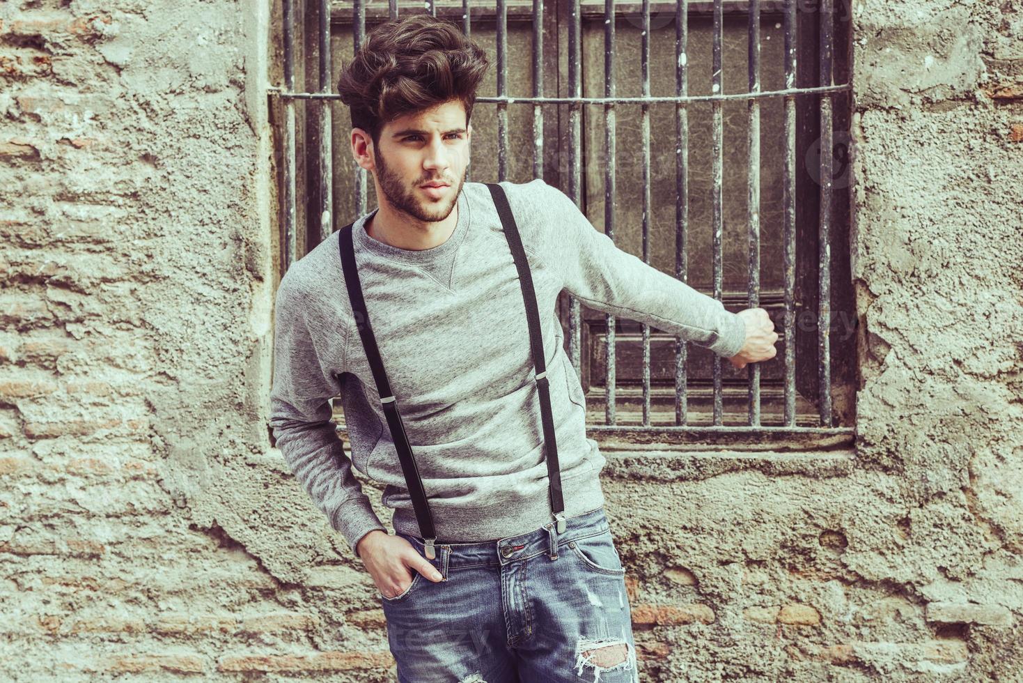 Man wearing suspenders in urban background 2885916 Stock Photo at Vecteezy