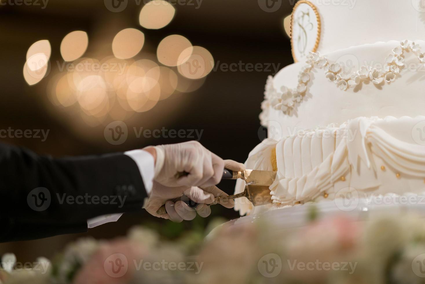 Cutting cake wedding, couple hand together, celebration photo