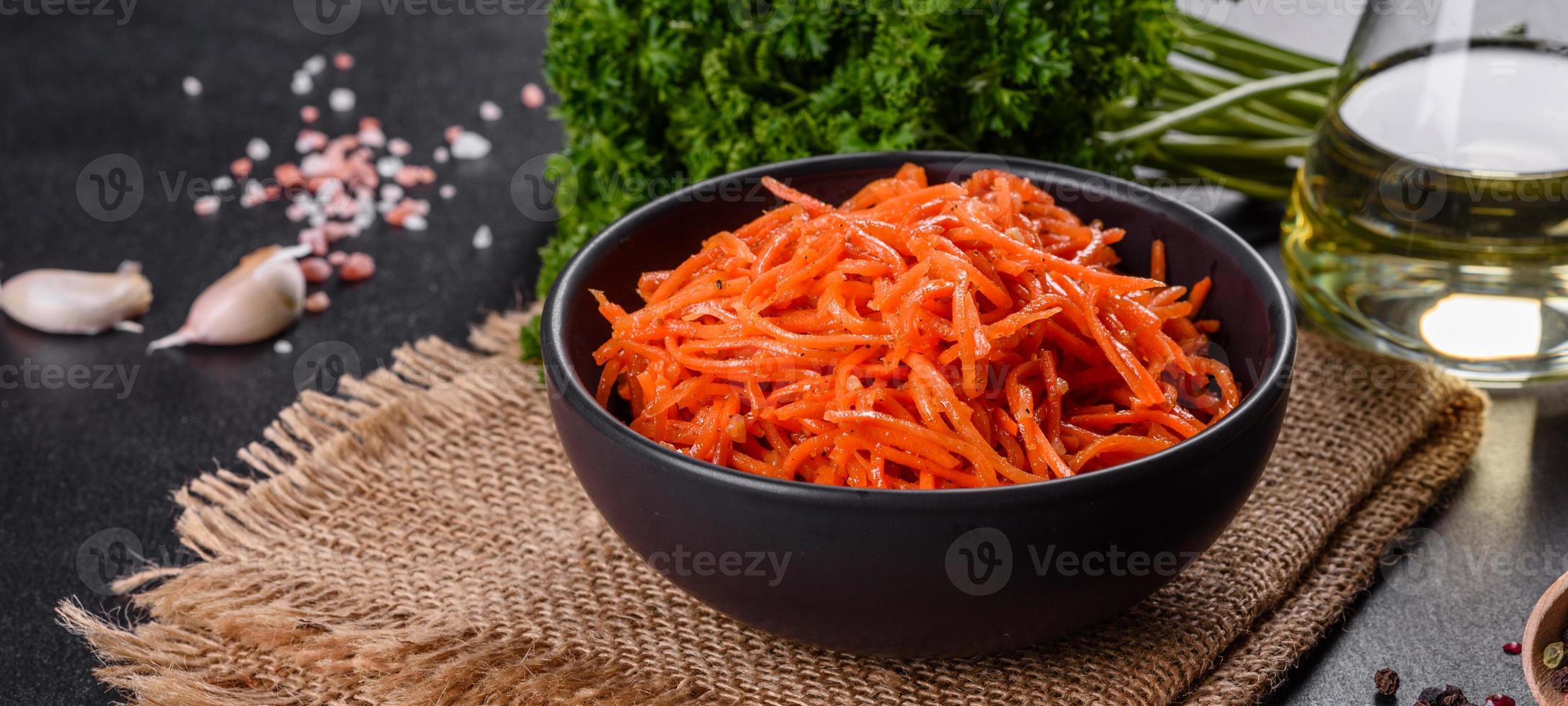 Delicious spicy juicy bright Korean carrots in ceramic dishes photo