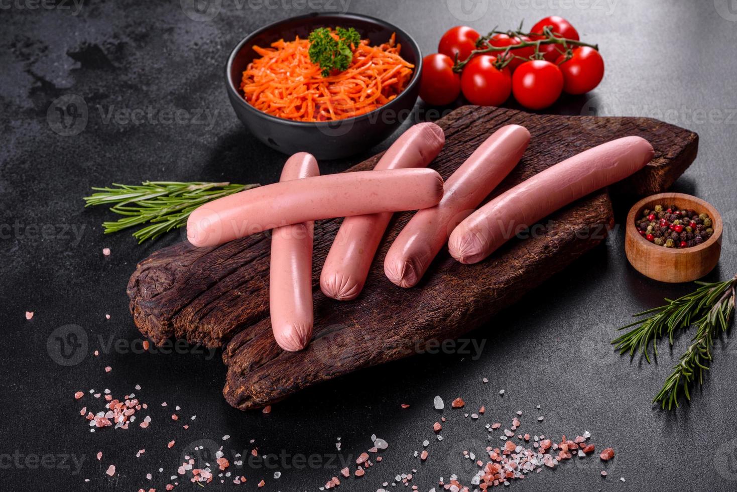 Delicious fresh boiled sausages with vegetables and spices photo