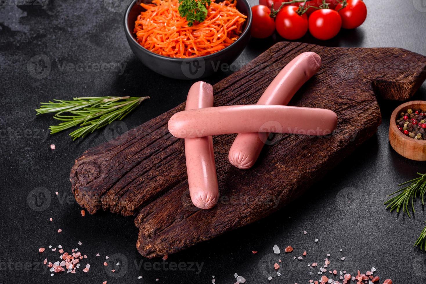 Delicious fresh boiled sausages with vegetables and spices photo