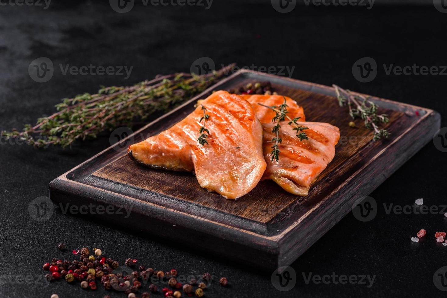 Tasty fresh red fish arctic char baked on a grill photo