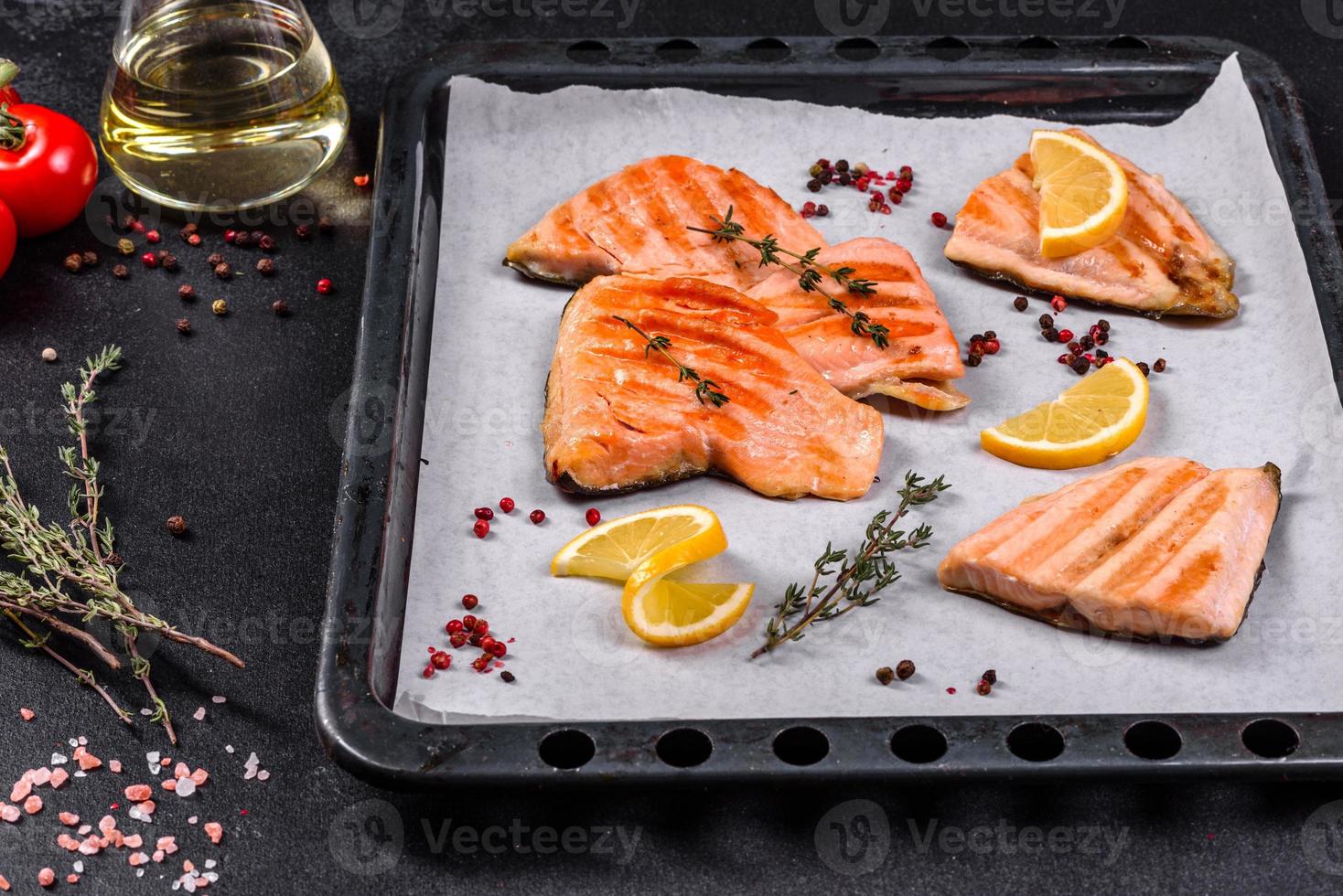 Tasty fresh red fish arctic char baked on a grill photo