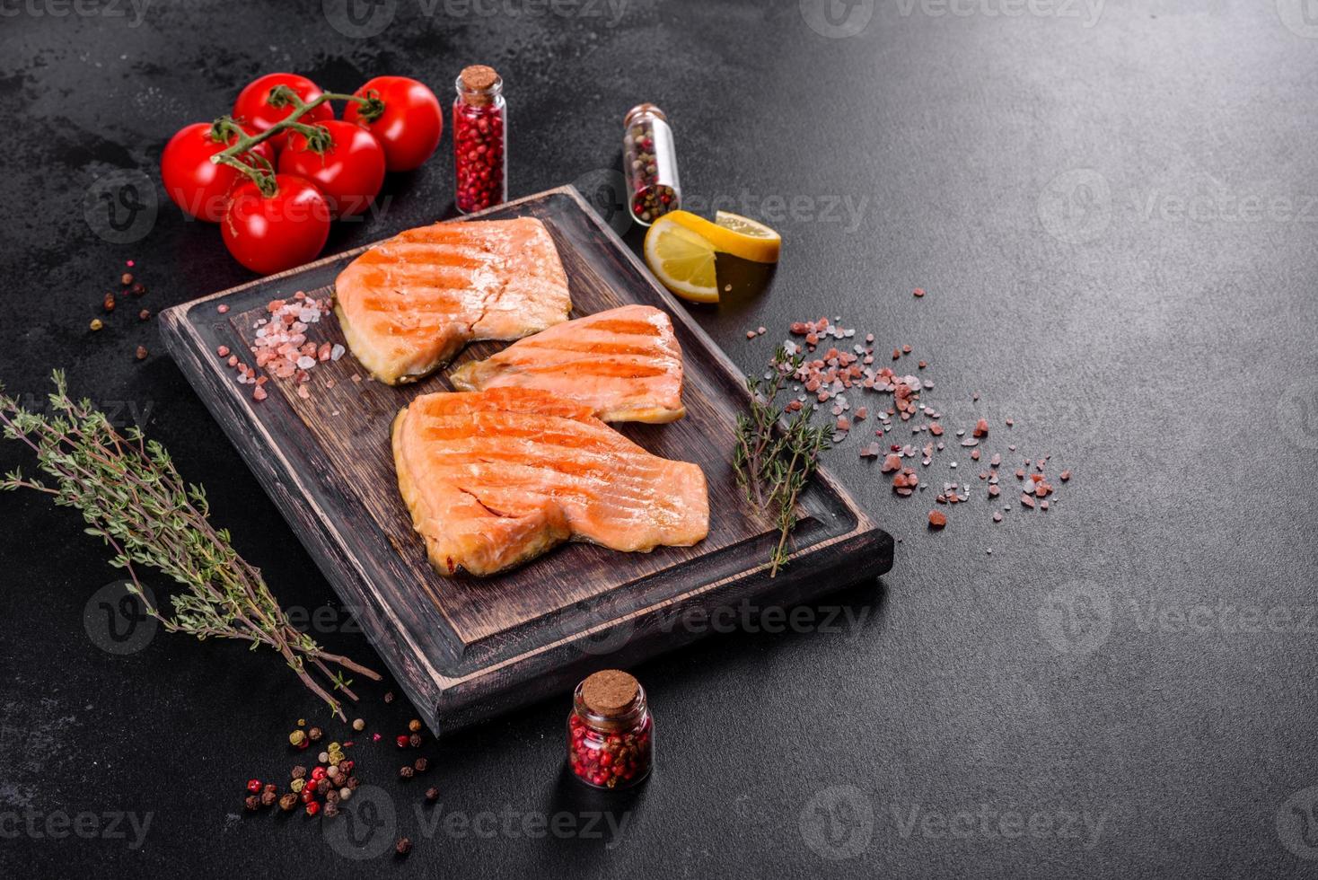 Tasty fresh red fish arctic char baked on a grill photo