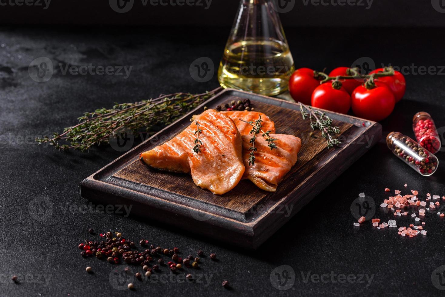 Tasty fresh red fish arctic char baked on a grill photo