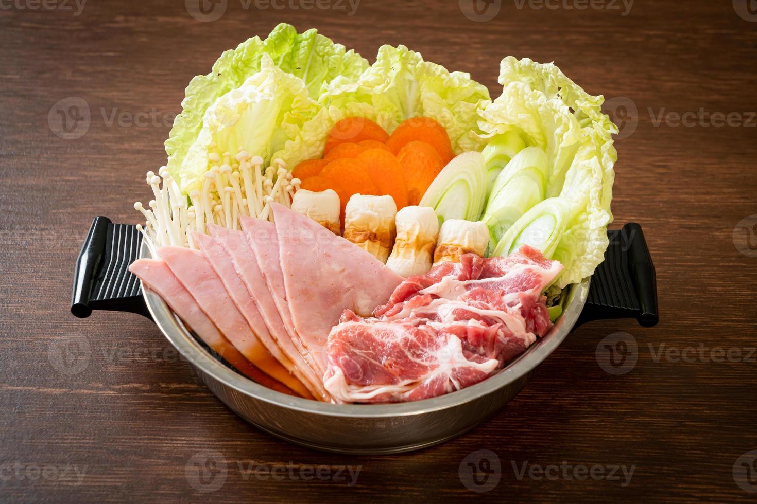 Sukiyaki or shabu hot pot black soup with meat raw and vegetable - Japanese food style photo