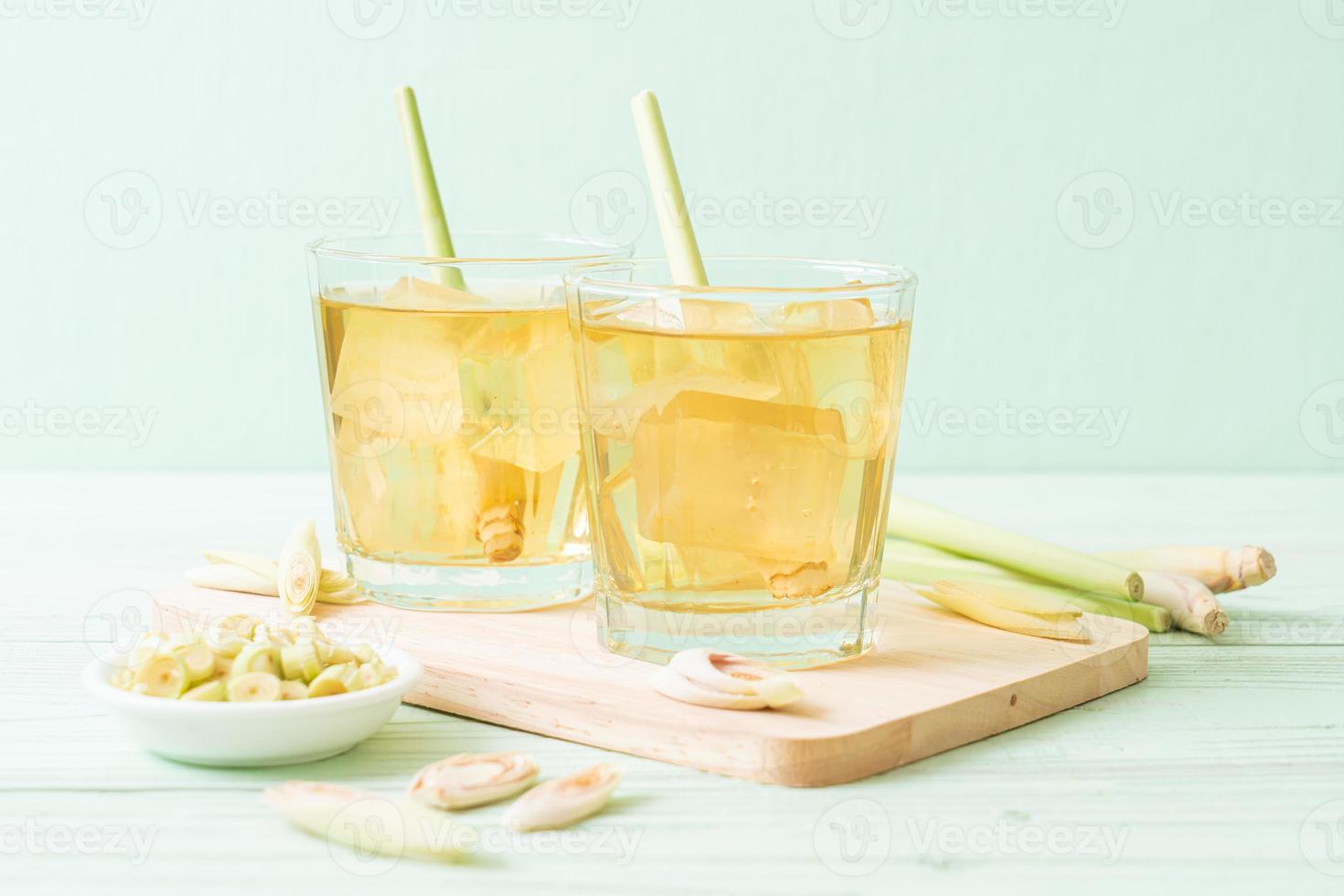 Iced lemon grass juice on wood background photo