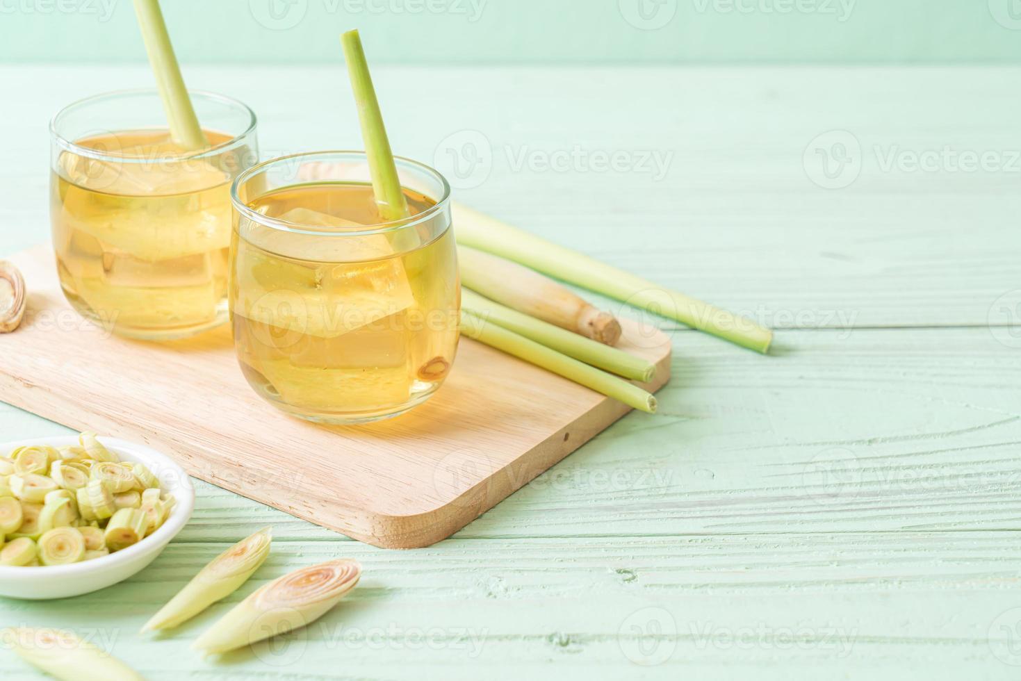 Iced lemon grass juice on wood background photo