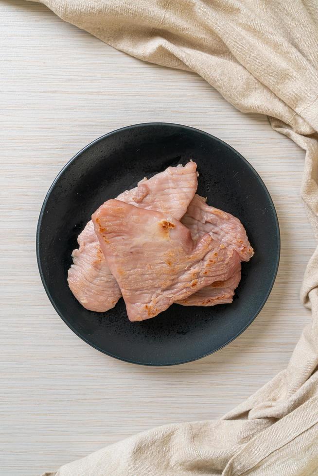 Fried sun-dried pork on plate photo