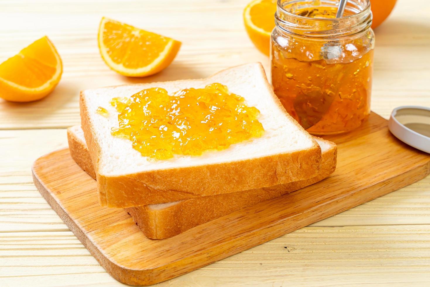 Slices of bread with orange jam photo