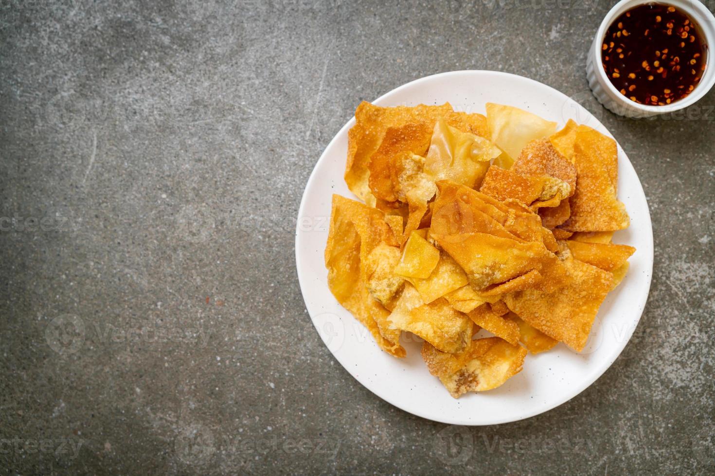 Deep-fried pork wonton with dipping sauce photo