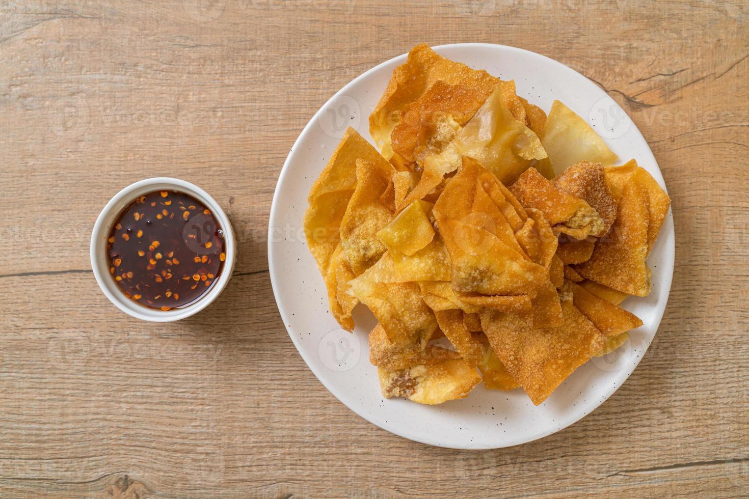 Deep-fried pork wonton with dipping sauce photo