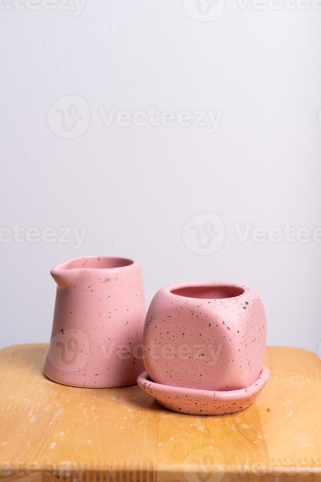 Empty and beautiful clay flower pot on wood table photo