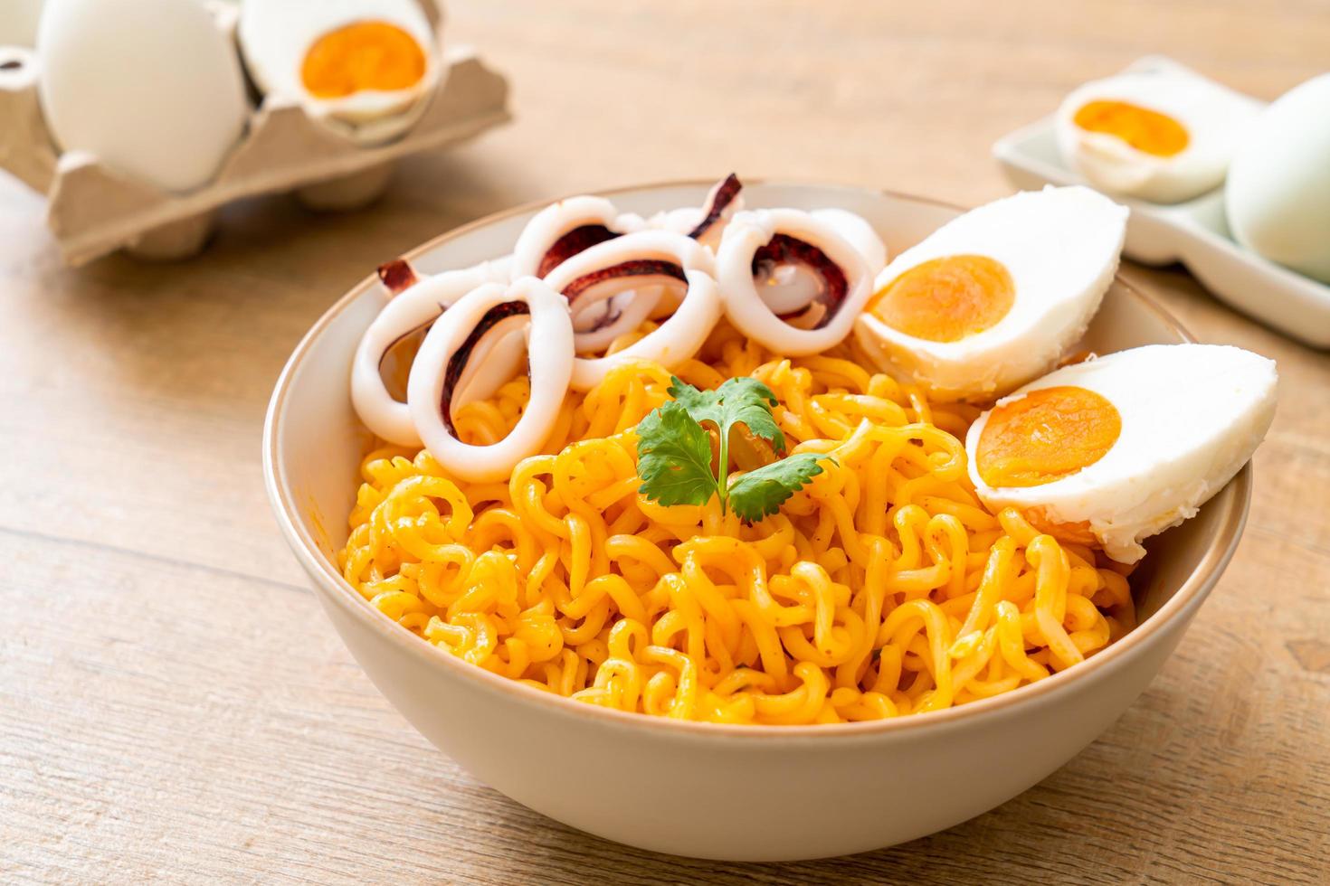 Instant noodles salt egg flavor with squid or octopus bowl photo