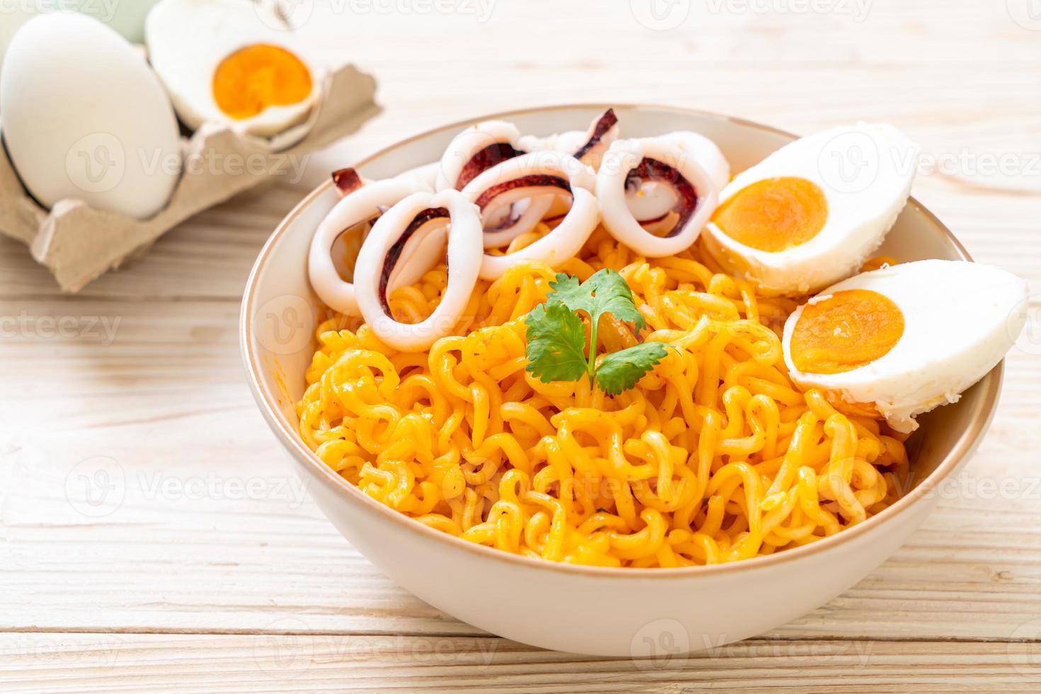 Instant noodles salt egg flavor with squid or octopus bowl photo