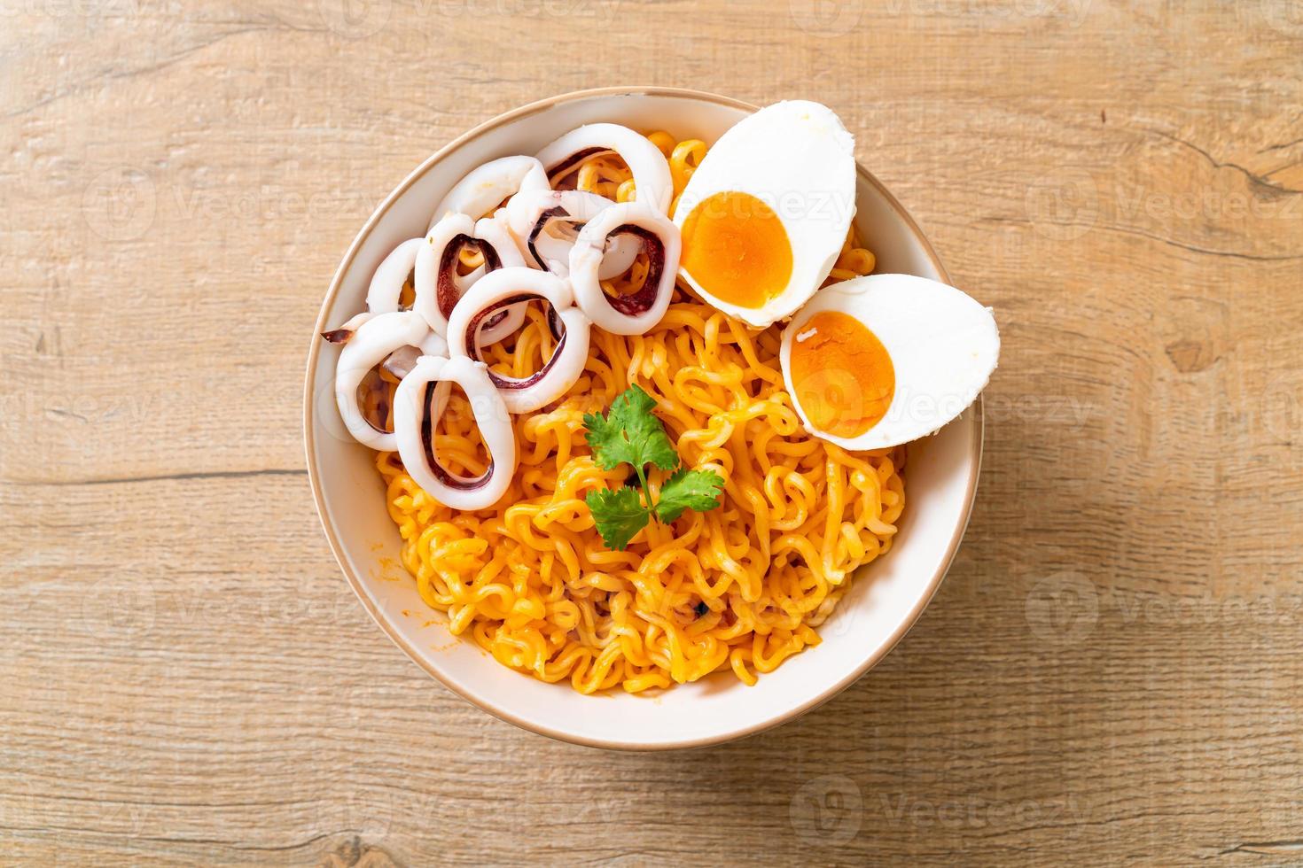 Instant noodles salt egg flavor with squid or octopus bowl photo