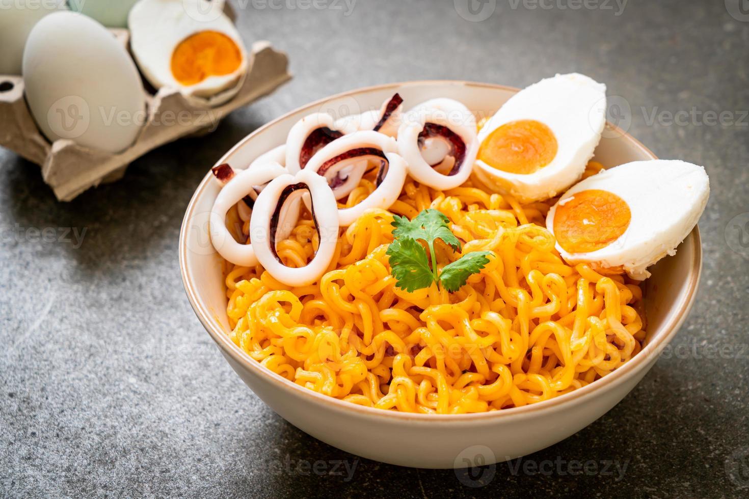 Instant noodles salt egg flavor with squid or octopus bowl photo