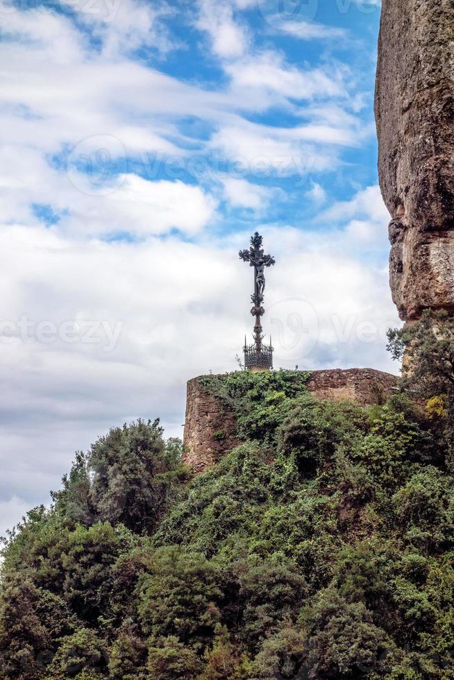 Barcelona Montserrat. Spain. Mountains, from afar visible place, mounted cross. photo