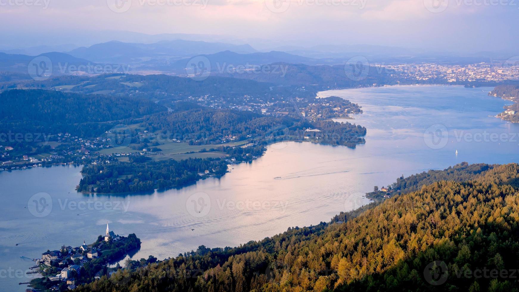 Evening view from observation tower Pyramidenkogel to mountains and lake Woerth,Carinthia,Austria photo