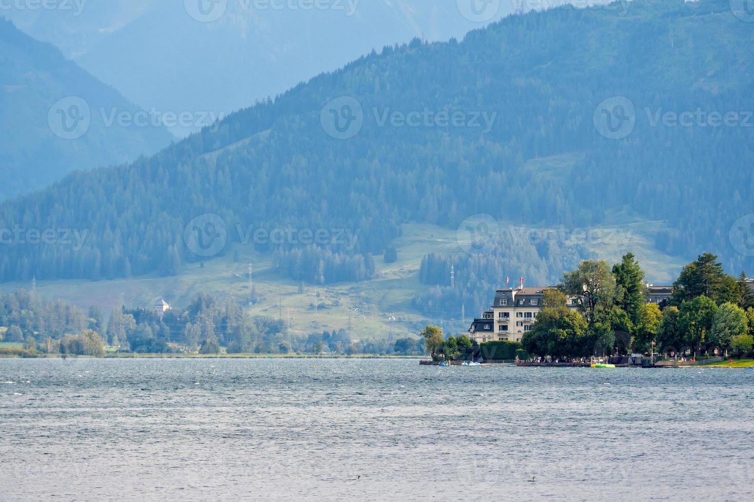 People relax at the Austrian mountain lake Worthersee. photo