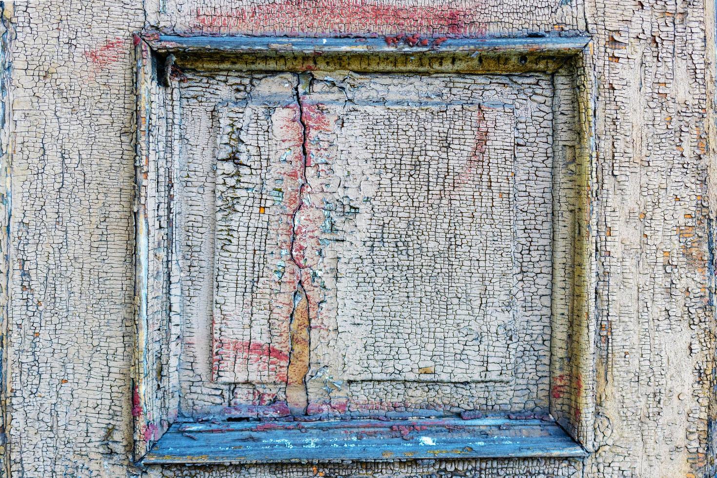 Close-up photo. A fragment of a wooden door with a broken color. photo