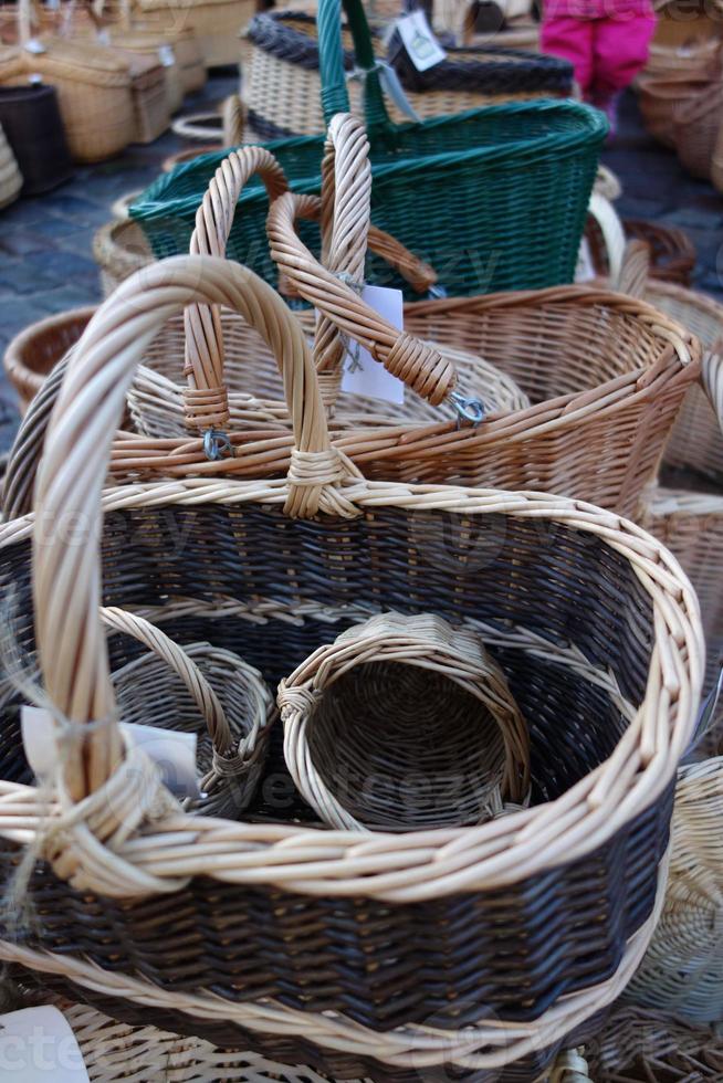 In the christmas  market a wide selection of a variety of hand-braided baskets. photo