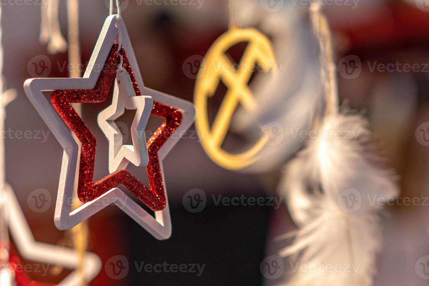 Different decoration, toy for xmas tree on christmas market, close up photo