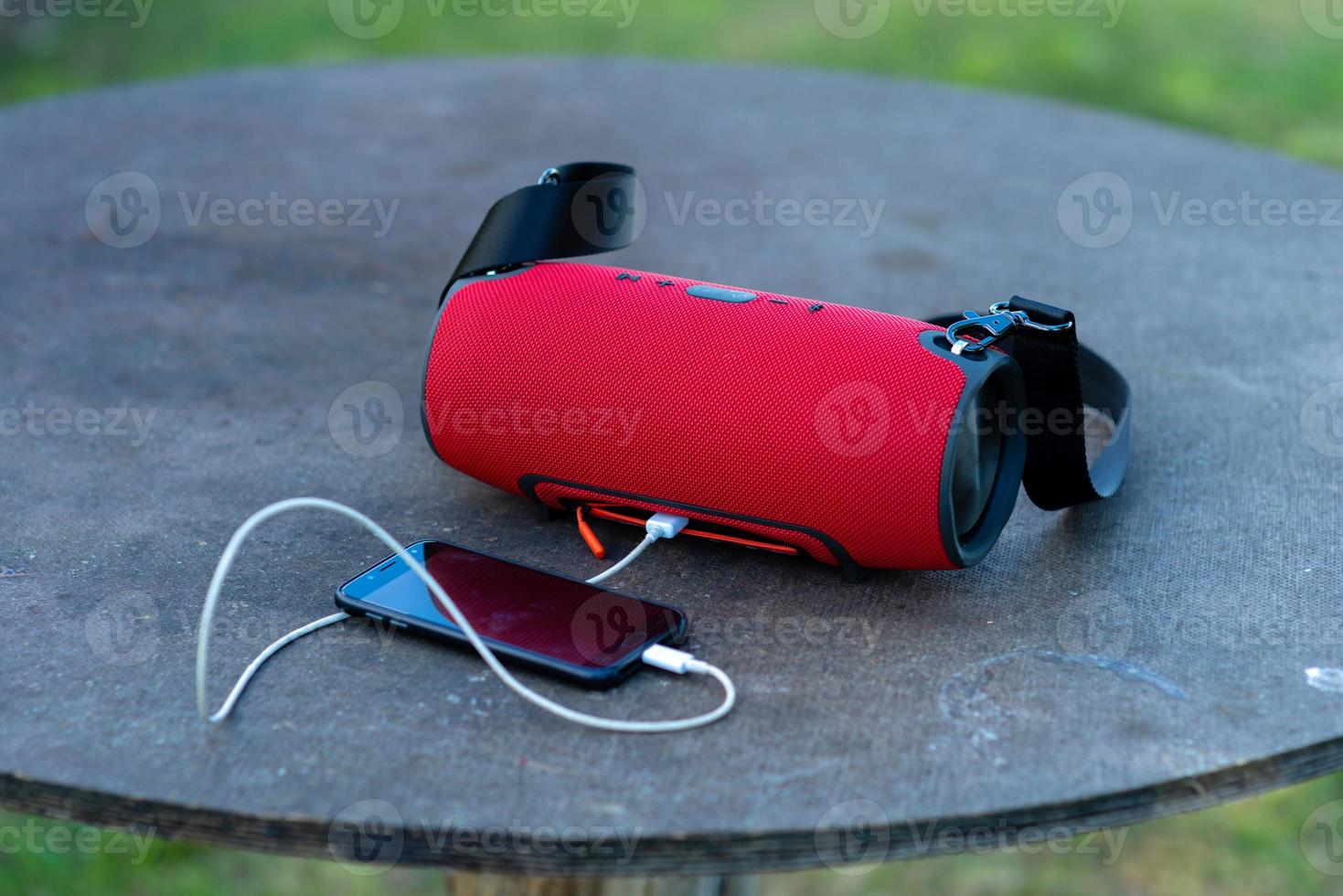 Smartphone with portable speakers photo