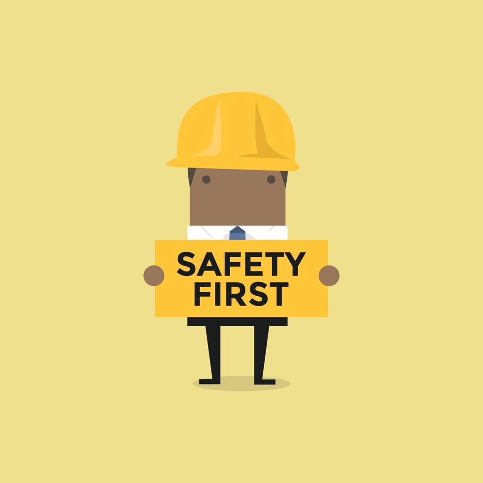 African businessman holding safety first sign. vector