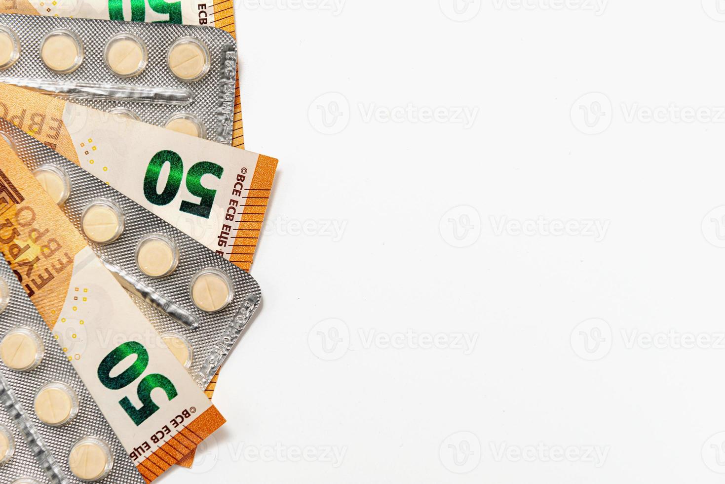 Medicines and Euro bills isolated on white photo