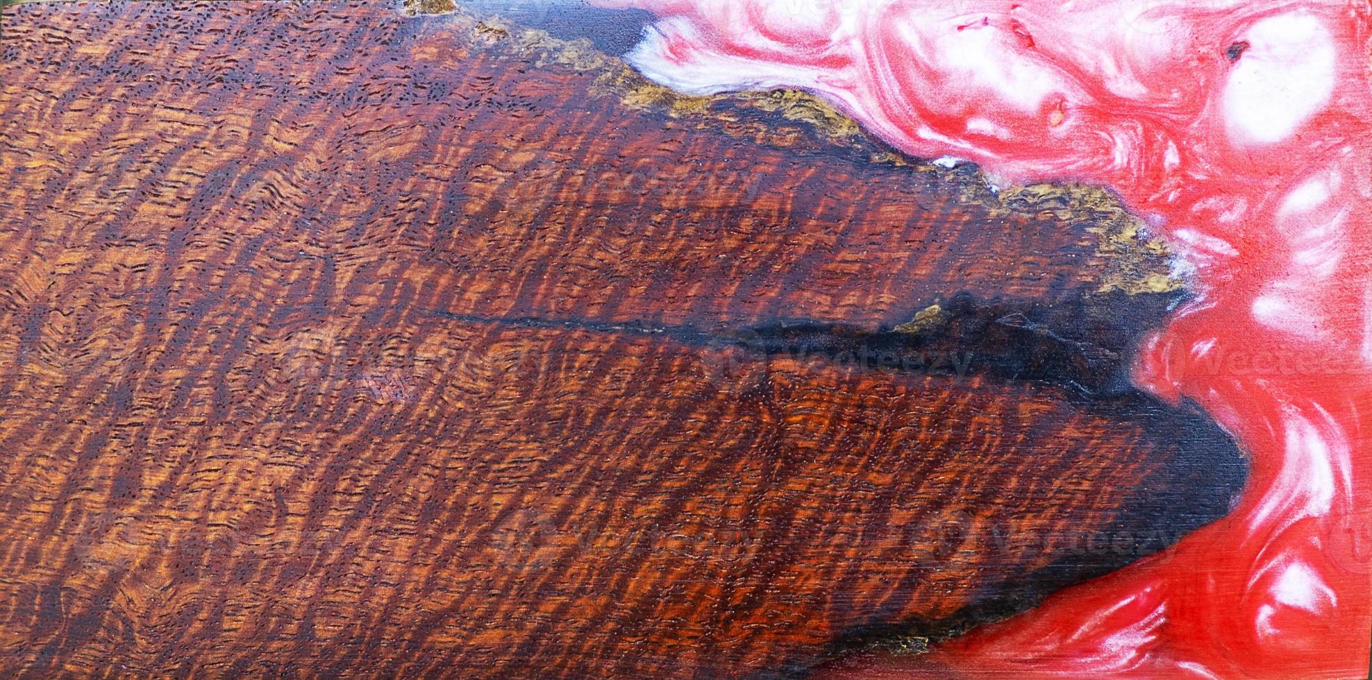 casting epoxy resin Stabilizing burl wood red color abstract art background photo