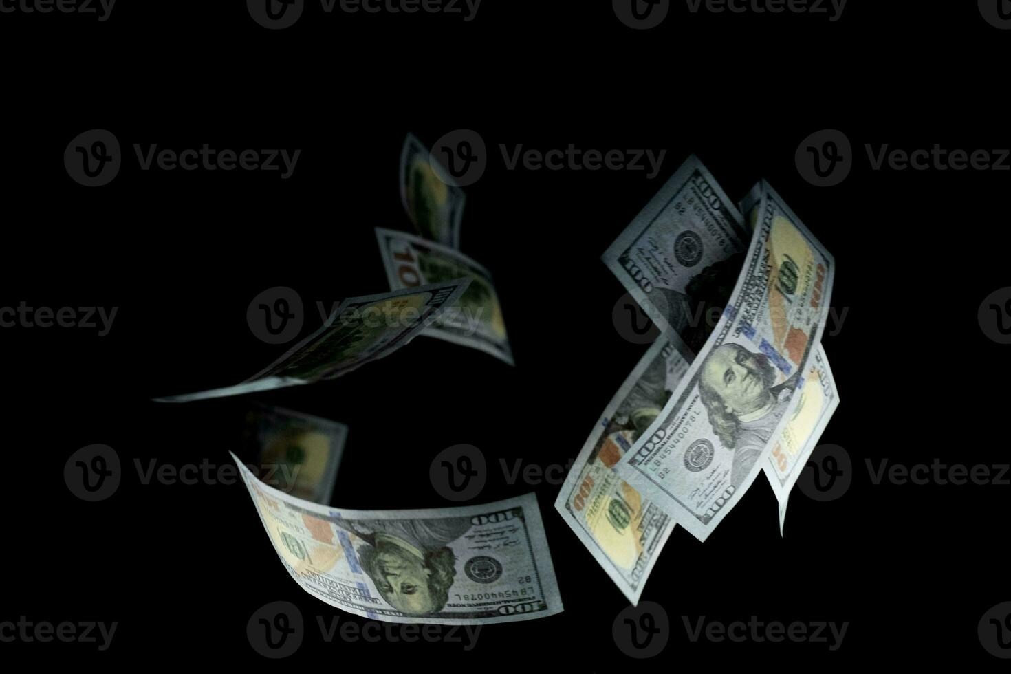 Group of money 100 US dollars banknotes at black background photo