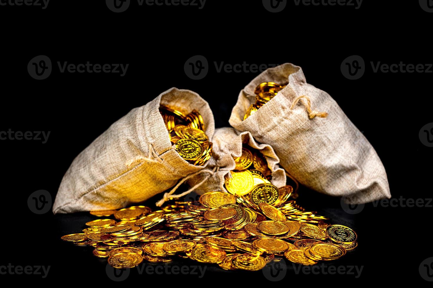 Stack gold coin in treasure sack photo