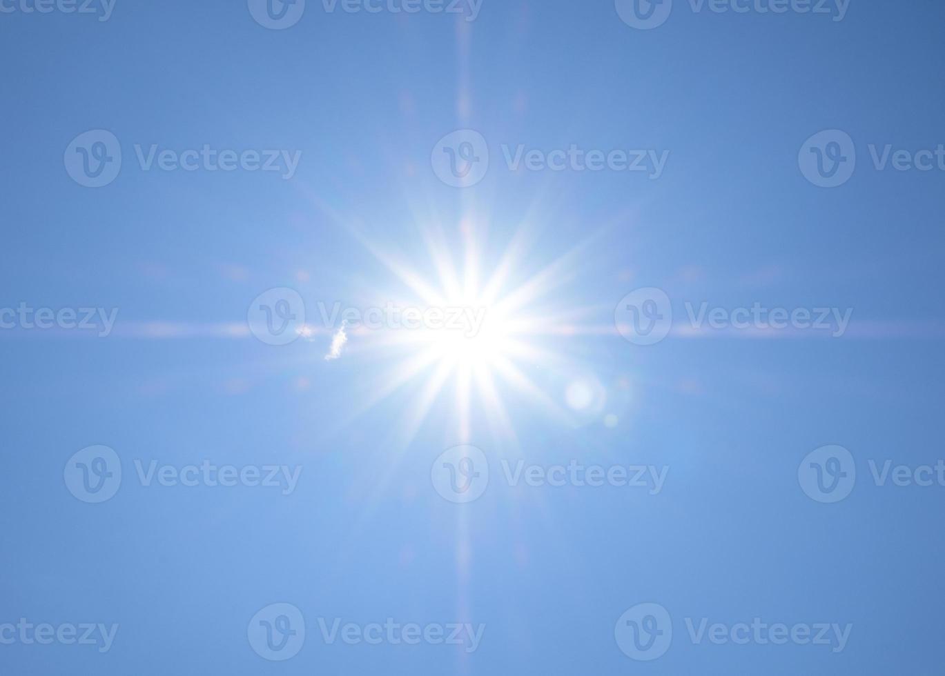 Sun and blue sky background photo