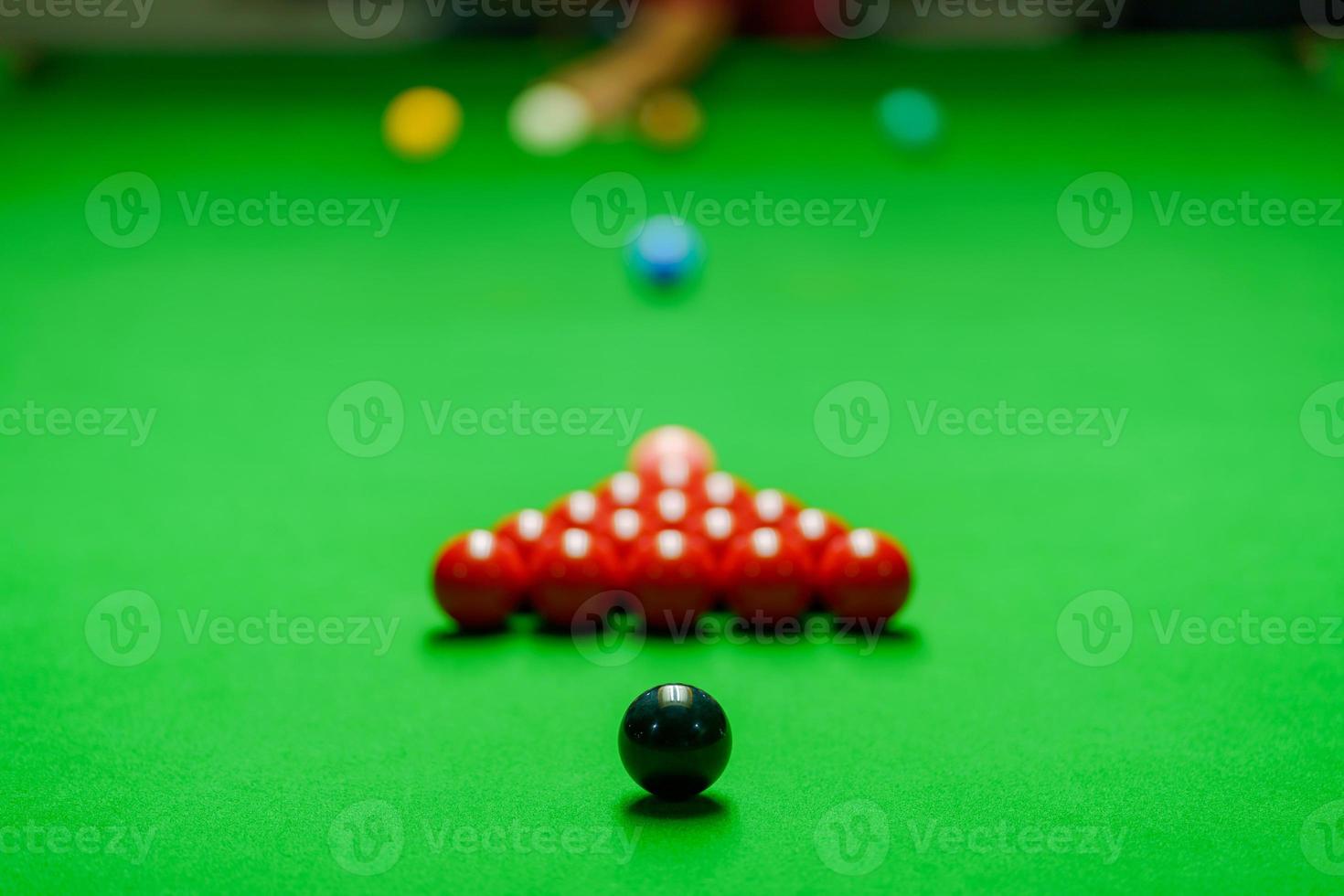 Player was shooting ball on green snooker table photo