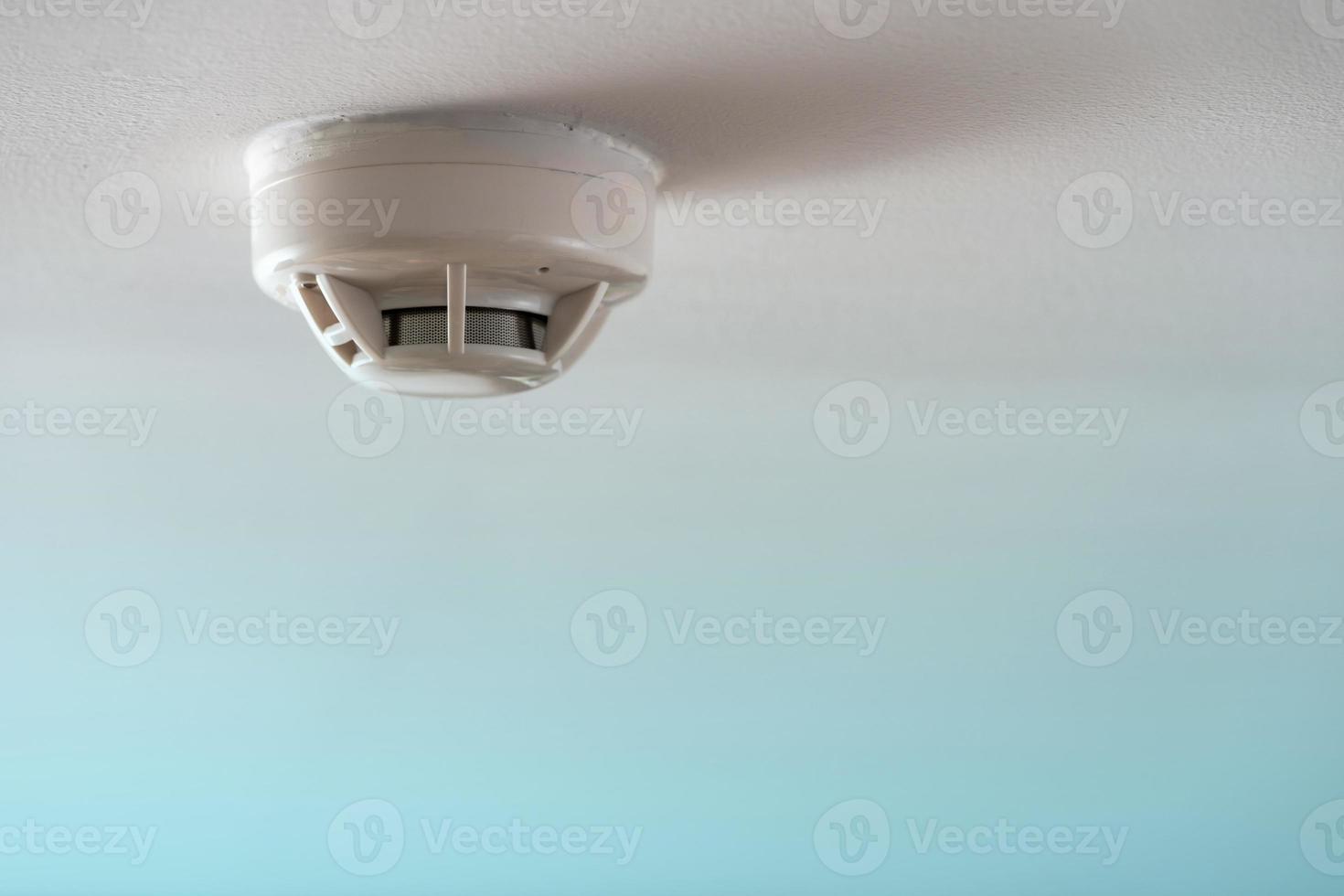 Smoke fire detector, Smoke detector on ceiling photo