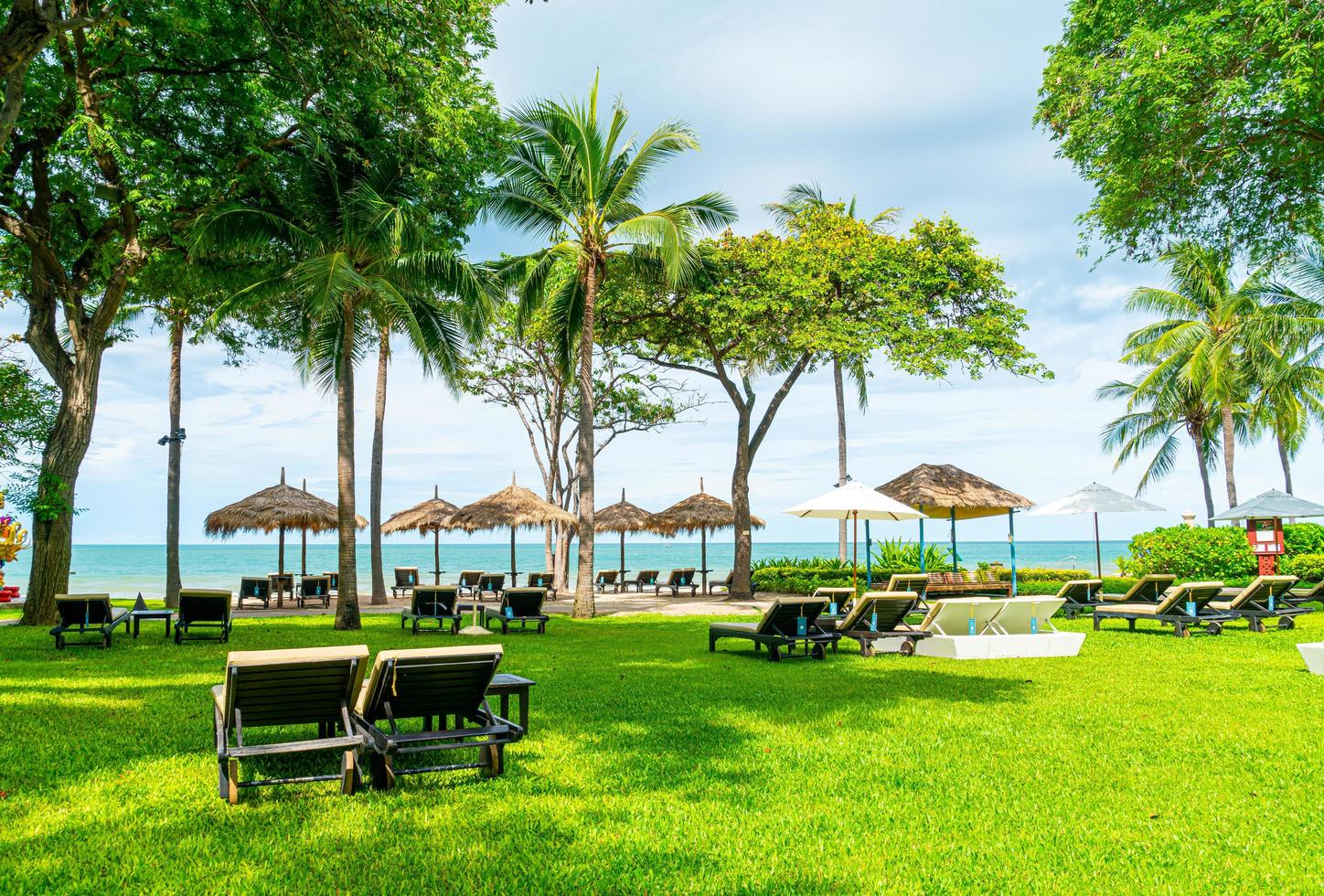 Empty beach chairs with sea beach background photo