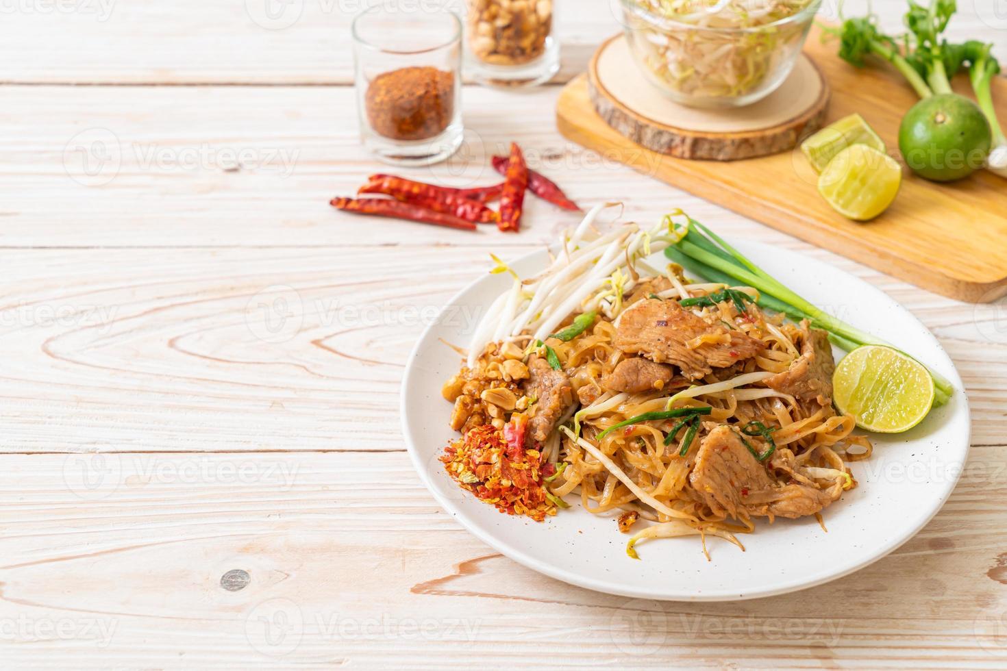 Stir-fried rice noodles with pork in Asian style photo