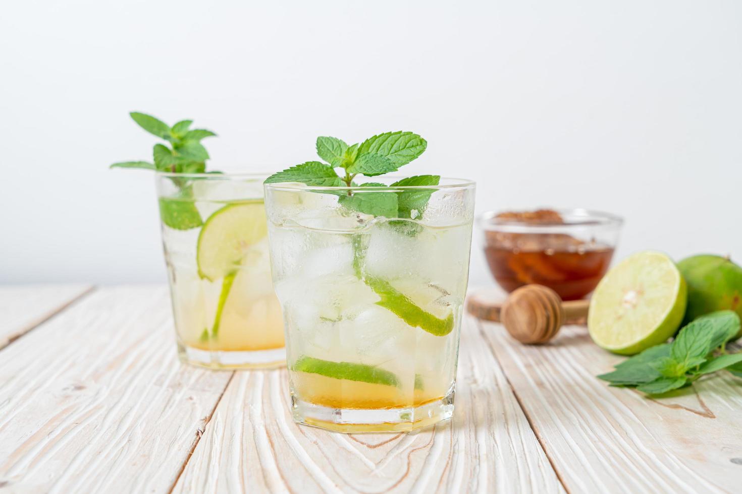 Iced honey and lime soda with mint - refreshing drink photo