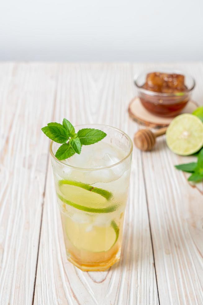 Iced honey and lime soda with mint - refreshing drink photo