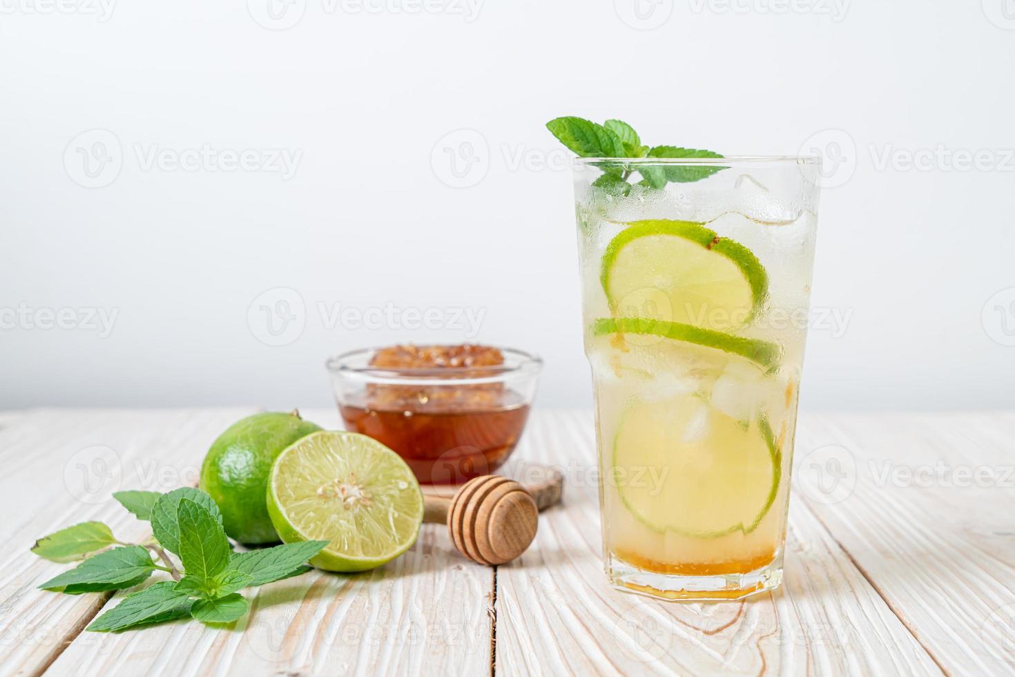 Iced honey and lime soda with mint - refreshing drink photo