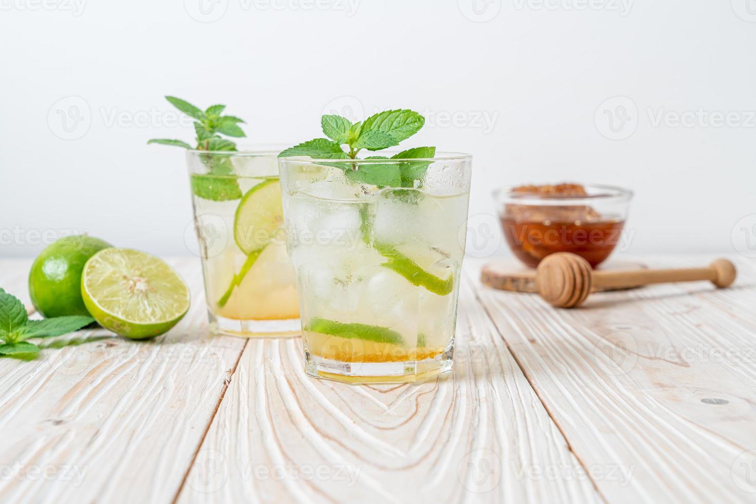 Iced honey and lime soda with mint - refreshing drink photo