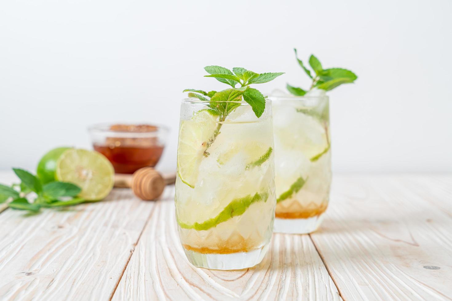 Iced honey and lime soda with mint - refreshing drink photo
