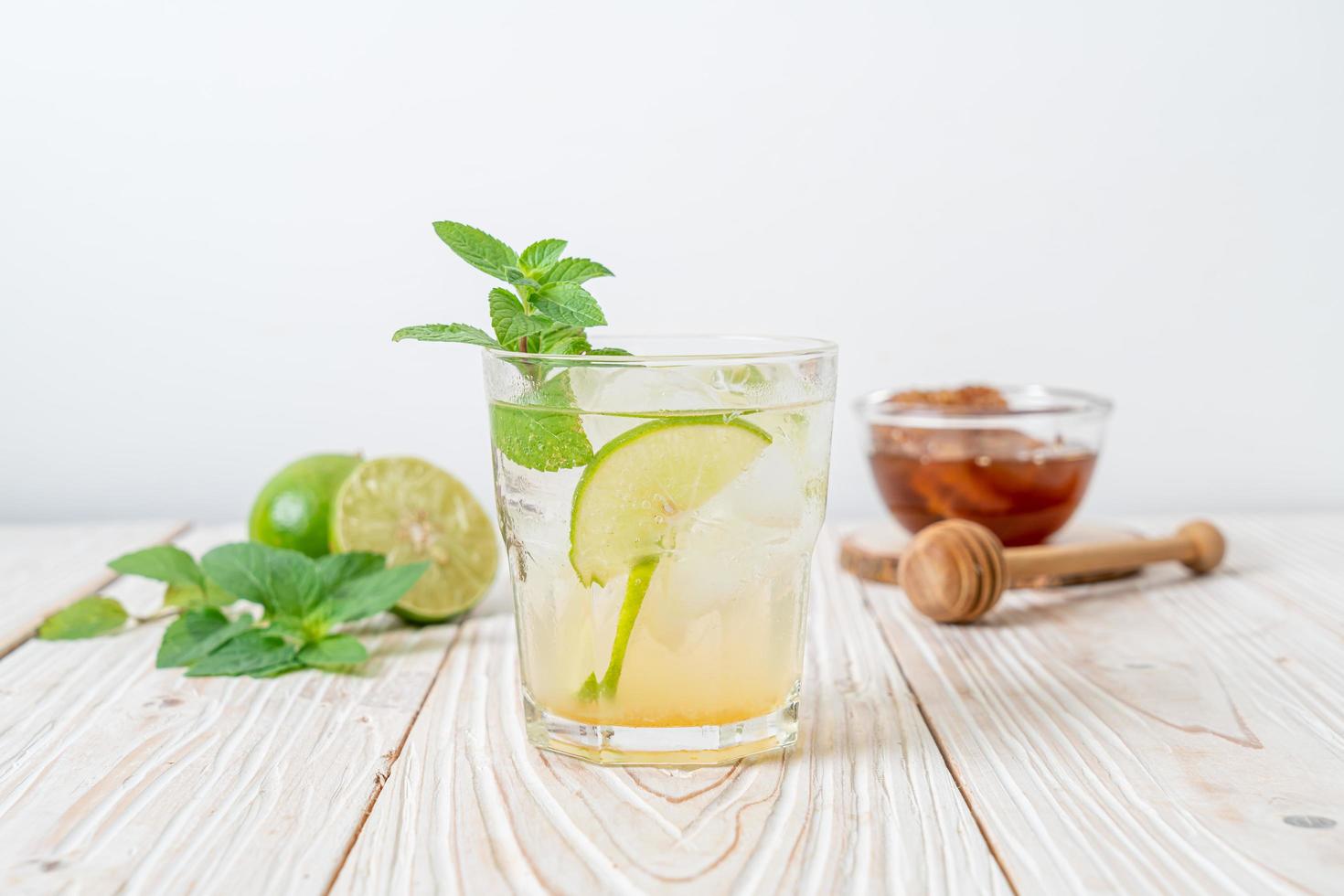 Iced honey and lime soda with mint - refreshing drink photo