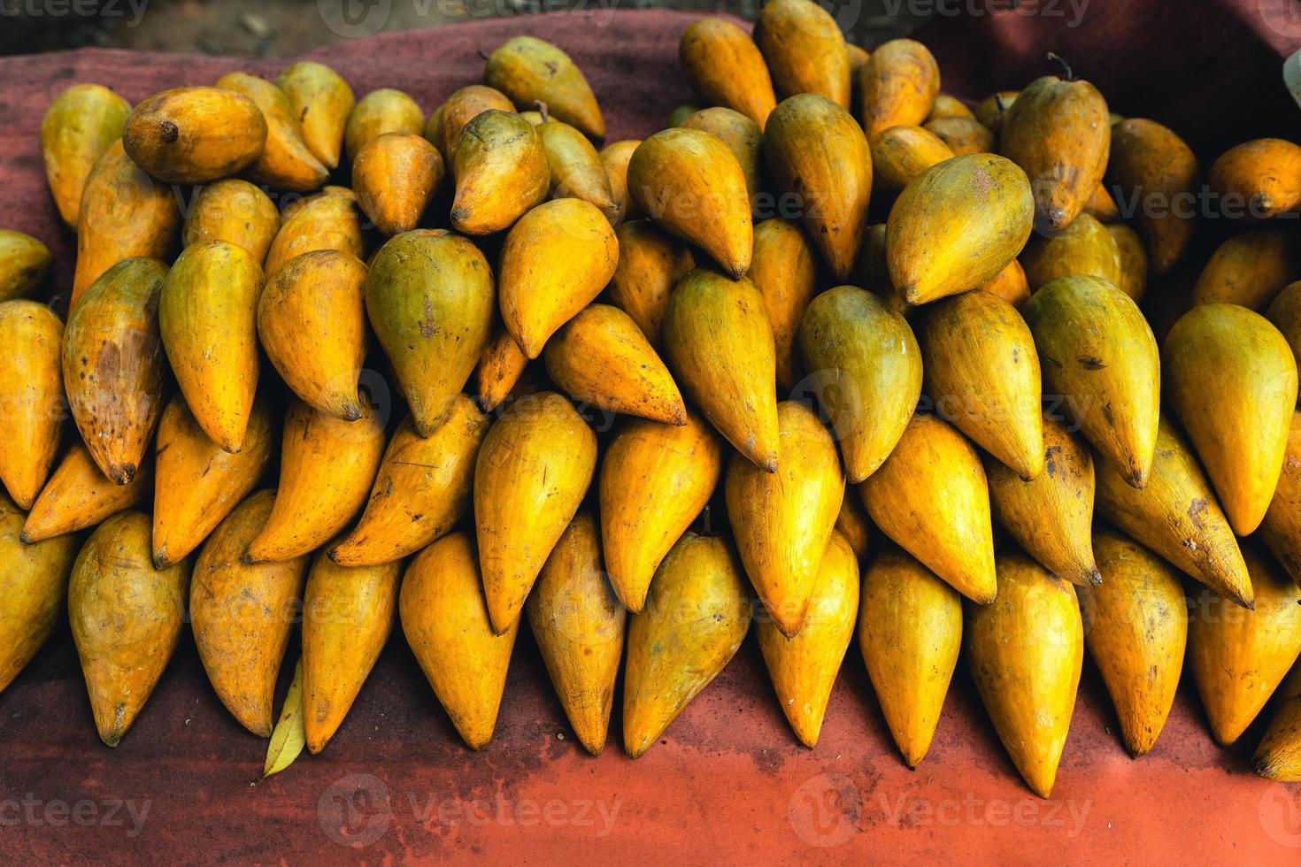 Canistel on a table at a street market photo