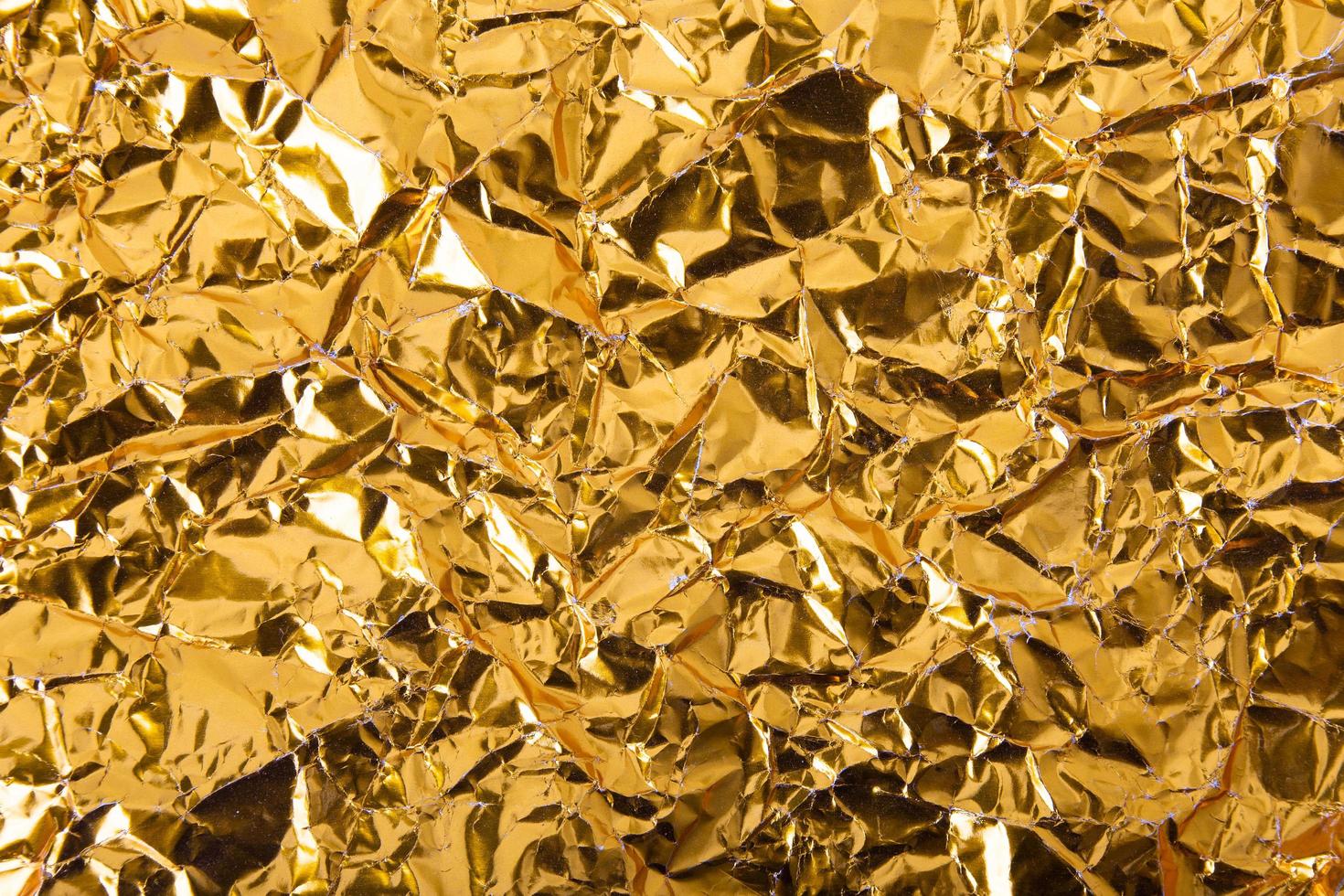 Gold paper crumpled texture background photo