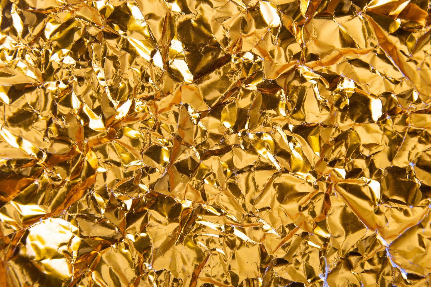 Gold paper crumpled texture background photo