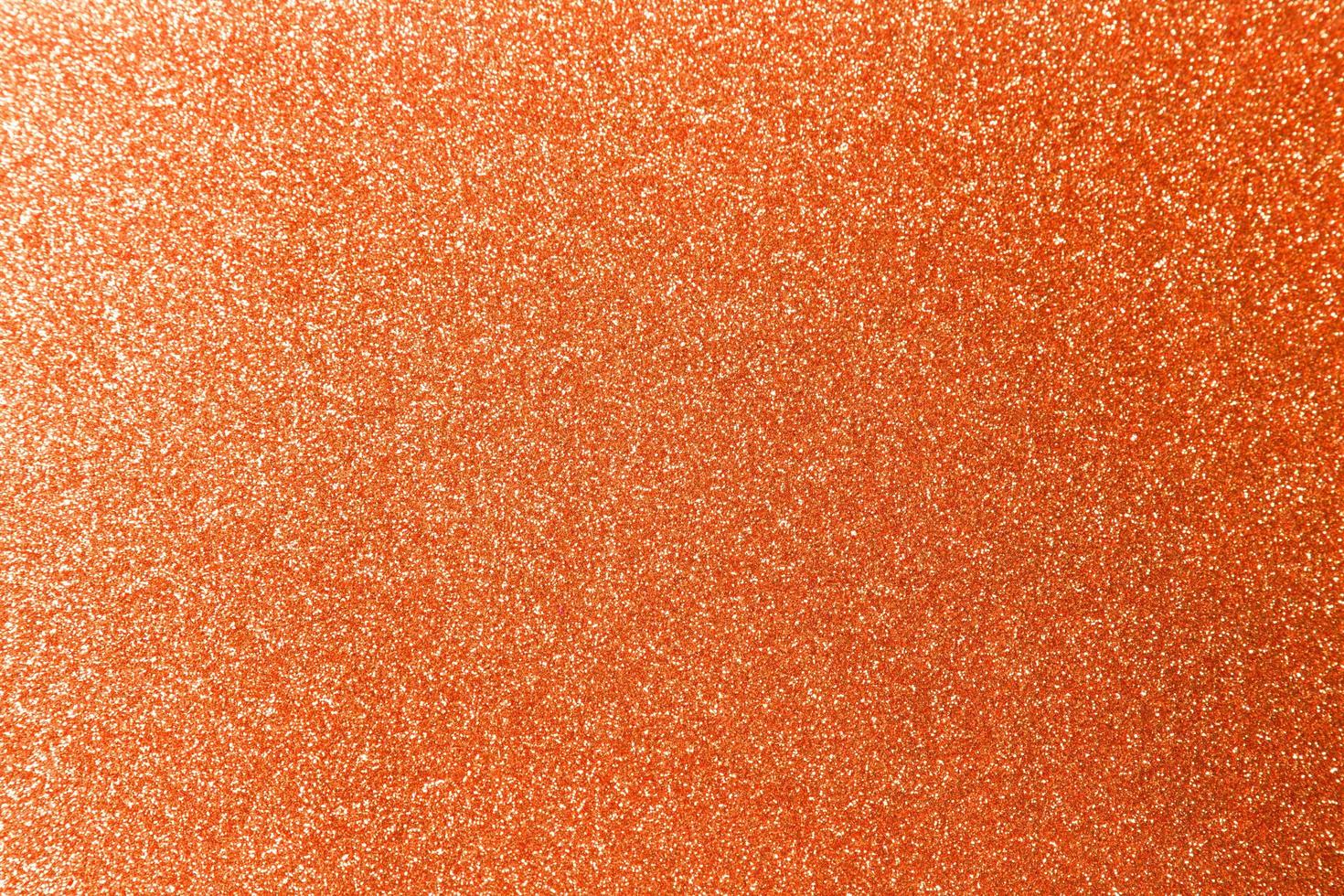 Orange glitter texture background photo