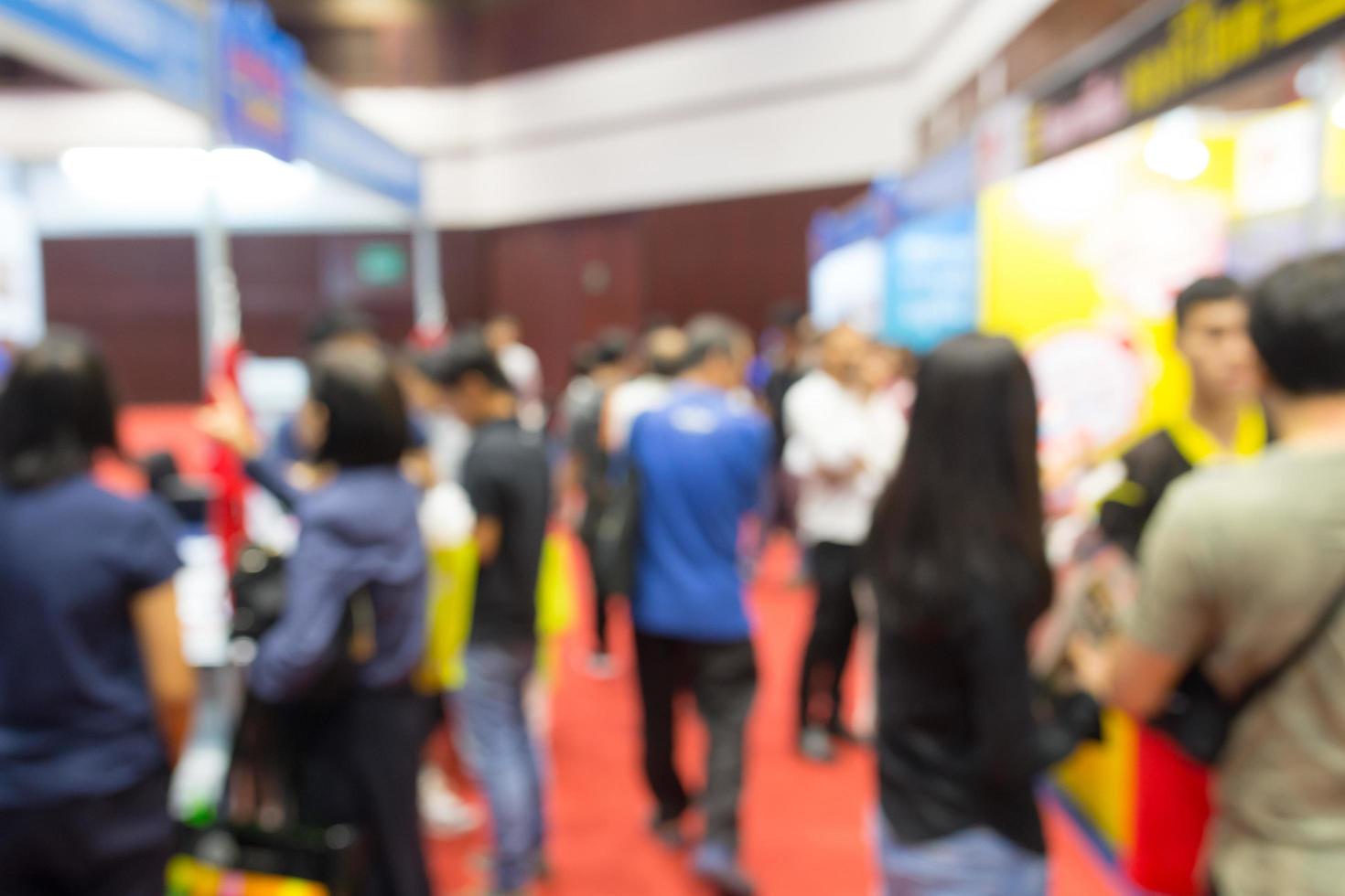 Abstract blurred people in exhibition, expo in hall photo
